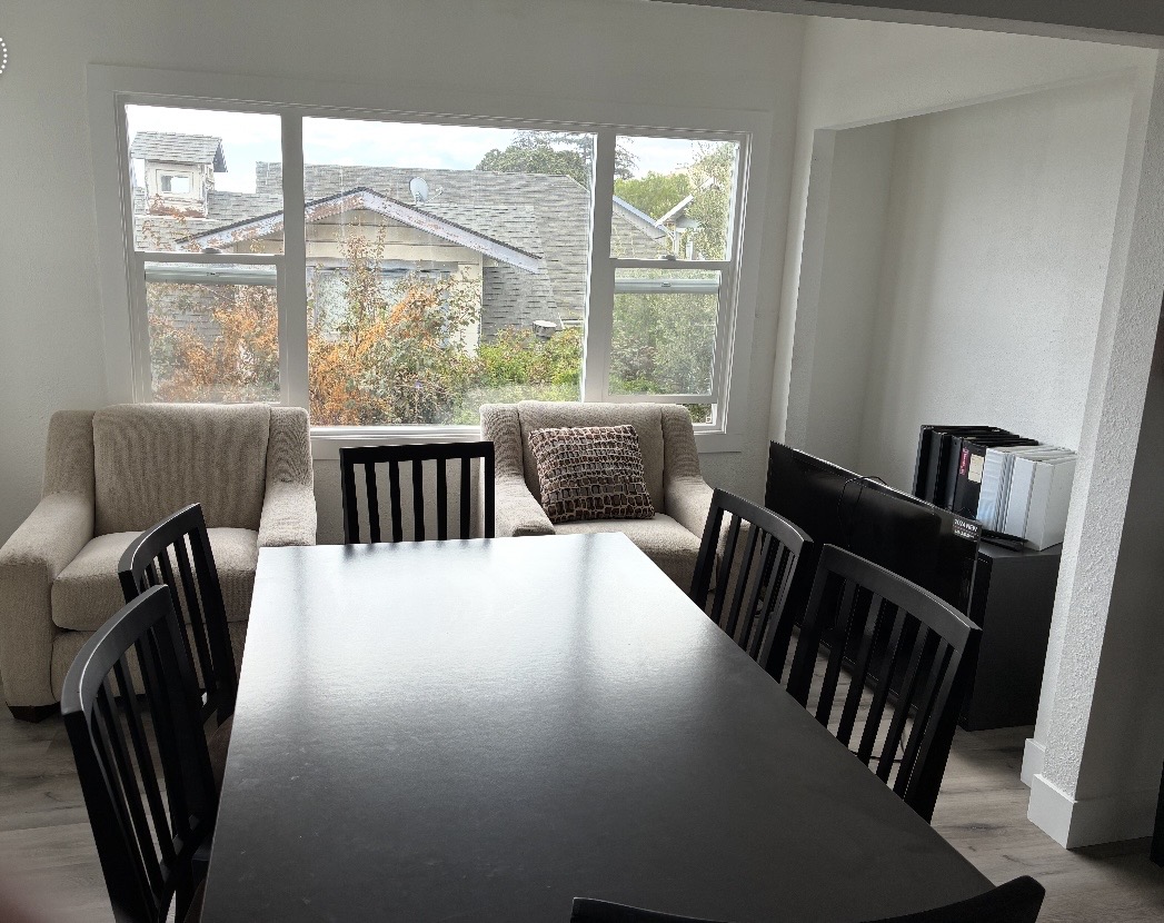 Bright dining area at RLG Manor with garden views and comfortable seating